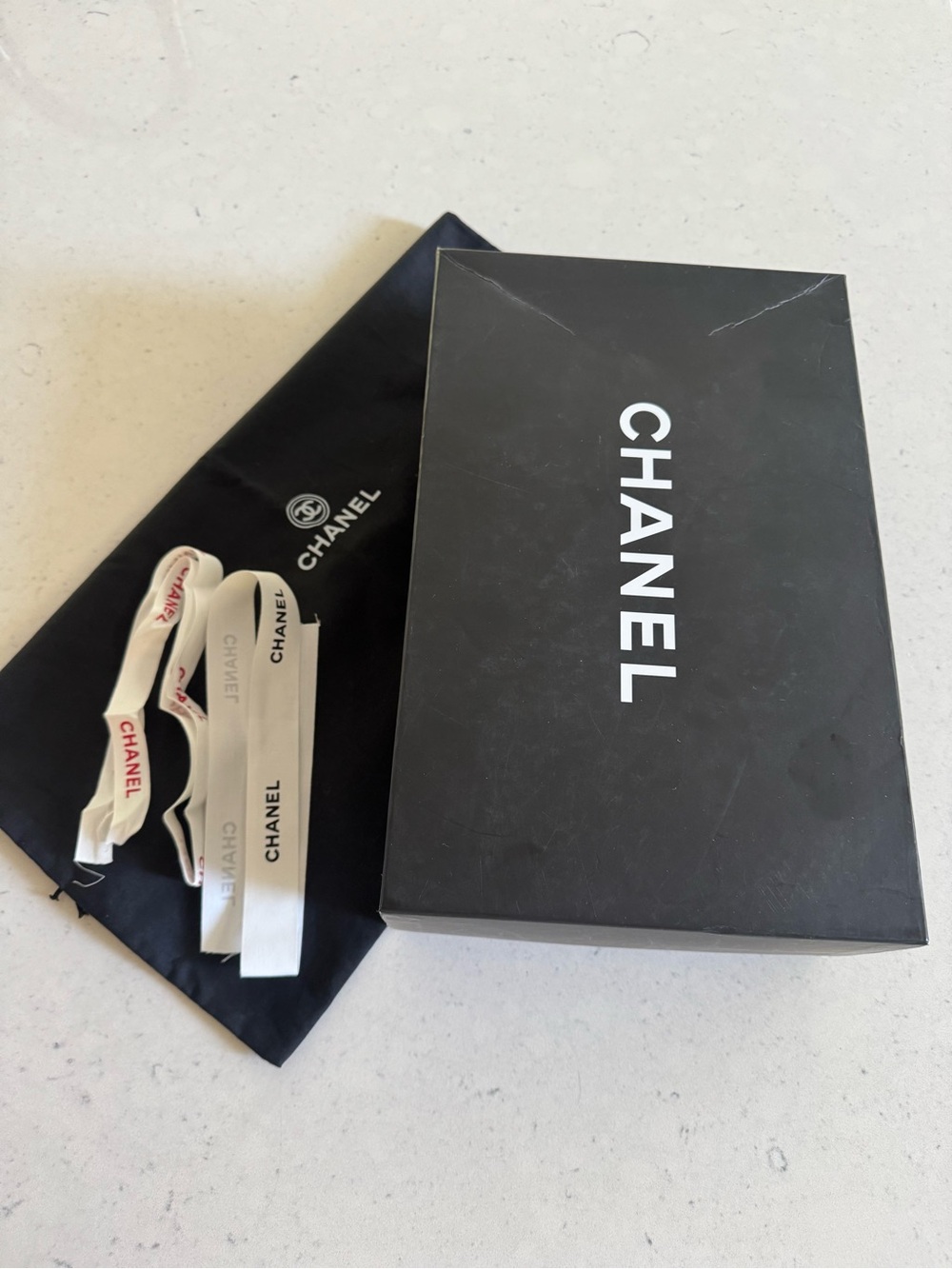 Chanel black shoe box, dust bag and ribbon set